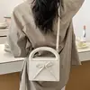 Bolso sencillo y exquisito con lazo para mujer, nuevo y elegante 2026, bolso versátil de alta gama para hombro y bandolera