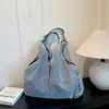 Bolsa de ganga transfronteiriça para mulheres, novo modelo 2026 bolsa tote, bolsa de ombro nicho casual para o dia a dia, bolsa de ombro retrô fashion