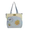 Bolsa de lona multi-color con estampado de pata de oso suave y linda, bolso de mano y bandolera de doble uso, bolsa escolar de gran capacidad para estudiantes