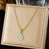 Colar com pingente de demônio de olhos azuis gota d'água banhado a ouro, estilo cool de rua europeu e americano, acessório de通勤 feminino em camadas requintado de nicho