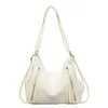 Bolsa Feminina Estilo Motociclista Vintage 2026 Nova Tendência Moda Bolsa de Ombro Textura de Nicho Grande Capacidade Bolsa Tote de Ombro