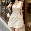 Elegante vestido de lunares estilo francés con cuello de muñeca para mujer, entallado en la cintura, sin mangas, con lazo y bolsillos, vestido corto acampanado adelgazante