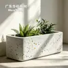 Las jardineras de terrazo pulido grueso para instalaciones públicas se pueden combinar y empalmar para su colocación en paisajismo de carreteras, plantación y como macetas decorativas.