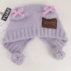 Adorable sombrero de peluche con orejas de oso y doble lazo estilo celebridad para mujer, sombrero cálido tejido estilo coreano para otoño e invierno que hace que la cara se vea más pequeña