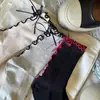 Nuevos calcetines de algodón transpirables de lujo ligero para primavera y verano, calcetines de felpa de media pantorrilla con lazo de madera y cinta, empaquetados al vacío