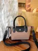 Nueva bolsa de tela de comercio exterior con un elegante diseño de PU, que presenta un aspecto único de patchwork, una gran capacidad y un diseño moderno de bloques de color, perfecta como bolso de hombro, bolso tote o bolso cruzado