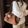 Bolsa Tote de Pelúcia Cor Lisa da Moda para Mulheres 2026 Verão Nova Bolsa de Ombro Único de Alta Qualidade para Axila de Nicho Grande Capacidade