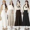 Nuevo faldón midi de punto para otoño e invierno para mujeres embarazadas, con rayas verticales, silueta en A, un diseño que cubre la barriga y crea un efecto adelgazante, y un bajo de cola de pez que se puede usar como capa exterior