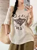 Camiseta de Linho Tingido em Fio com Estampa, Manga Curta, Gola Redonda, Corte Solto, Emagrecimento, Versátil, Estilo Casual e Relaxado - Nova Peça de Verão