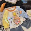 Camiseta de Manga Larga para Niños 2026 Primavera Nuevo Estilo Parche de Dibujos Animados Lindo Mangas Patchwork para Niños y Niñas Estilo Coreano Camiseta Base Moderna