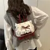 Mochila de Viagem com Laço Feminina 2025 Verão Nova Moda Casual Mochila Escolar Estudante Universitário Deslocamento Mochila de Mão