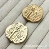 Botones metálicos plisados irregulares para trajes, abrigos de lana tejidos, botones decorativos simples y versátiles cosidos a mano
