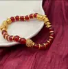 Pulsera Retorcida de Ágata Roja Hueca Exquisita de Lujo Ligero de Año Nuevo con un Toque de Alta Gama y Elegancia Versátil