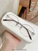 Armazones de anteojos de titanio puro para mujer, estilo business tradicional, colección de anteojos de medio aro ultraligeros, armazón de anteojos Danyang M0043
