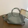 Bolsa de Cuero Genuino Transfronteriza para Mujer al por Mayor Diseño de Nicho de Gama Alta Simple Casual Gran Capacidad Tote Cruzado Bolsa Dumpling