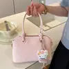Bolso de mujer de alta gama de nicho 2026 nueva versión coreana bolso de hombro cruzado simple y elegante bolso de mano de gran capacidad moderno