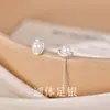 Pendientes de botón de perla en lingote de plata de ley S999 Pendientes simples de lujo ligero de nicho Cuidado del agujero de la oreja Tapones para los oídos