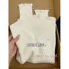 Camisa básica exquisita estilo francés estilo miu con dobladillo fruncido para mujer, suéter interior de cuello medio alto para otoño e invierno, top de punto de manga larga