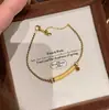Pulseira de Pedra Olho de Tigre Sorridente para Mulheres Design de Nicho Luxo Acessível Retro de Ponta Alto Valor Clareador Moda Pulseira Preto Dourado