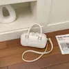 Bolsa de bolos para mujer, nuevo estilo coreano de moda primavera 2026, bolso de mano de alta gama versátil para el hombro y cruzado para el trabajo