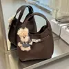 Otoño/Invierno 2026 Nuevo Bolso Cubo de Piel Suave Estilo Coreano de Alto Valor Gran Capacidad Bolso de Mano para el Trabajo Bolso de Hombro Bolso Cruzado