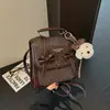 Mochila de Ombro Duplo Cor Sólida Simples Elegante com Laço Estilo Coreano para Mulheres 2026 Novo Estilo Personalidade Casual Alta Aparência Bolsa Transversal