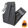 Pantalones deportivos para hombre de nueva temporada otoño-invierno, corte holgado, talla grande, forro polar, pierna recta, color liso, elásticos, engrosados, casuales para hombres jóvenes