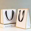 Bolsas de Papel Blanco en Stock, Bolsas de Regalo, Bolsas Tote para Compras de Ropa, Empaque con Cuerda Ondulada, Cinta, Bolsas de Papel Kraft, Hecho a Medida