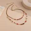 Collar cruzado de cristal acrílico con cuentas europeo y americano, con un estilo retro Melard, una cadena ligera y lujosa para suéter, y un diseño de alta gama para mujer