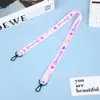 Cordón para funda de teléfono móvil insignia linda de dibujos animados juego de tarjetas cordón bolsa de juguetes certificado cordón para colgar al por mayor