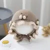 Bonitos y adorables gorros de otoño e invierno para niños, con diseño de poner, material de punto y una serie de dibujos animados, que brindan abrigo y protección para los oídos para bebés y niños pequeños.