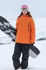 Nuevo Conjunto de Traje de Esquí 2025 para Mujeres, Invierno Tabla Única y Doble Impermeable y a Prueba de Viento Abrigado Espeso Conjunto de Chaqueta y Pantalones de Esquí para Hombres