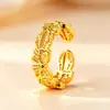 Anillo nuevo estilo antiguo oro arena filigrana nudo de mariposa hueco diseño de nicho sentido de diseño lujo ligero anillo ajustable fuente para transmisión en vivo