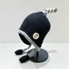 Gorro de lana tejido con protección para los oídos para niños y bebés, transfronterizo, con etiqueta de tela elegante, correas de colores caramelo para niños y niñas