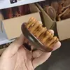 Venta al por mayor desde la fábrica de origen: Peine de masaje de sándalo con pequeñas imperfecciones, peine con cojín de aire, peine de masaje de meridianos del cuero cabelludo, unisex