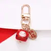 Estilo Chino Atrae Fortuna Cerámica Gato de la Suerte Llavero Colgante Estuche para Auriculares Bolso Encanto Accesorio Adornos Pequeños Venta al por Mayor