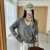 Suéter de punto de alta gama de dos piezas falso con cuello en V para mujer, nuevo estilo coreano de primavera/otoño, corte holgado, diseño adelgazante, longitud corta con cordón