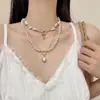 Collar redondo de perlas con cuentas vintage, moda nicho de alta gama, cadena para la clavícula simple y elegante, accesorio de lujo ligero exquisito y versátil