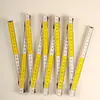 Regla plegable de madera 2.1m Plegable Amarillo y Blanco Escala bicolor Plegado por resorte Regla de madera plegable