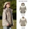 Tmall con el mismo estilo ropa de montaña impermeable a prueba de viento desmontable tres en uno para mujer otoño e invierno abrigo hombre