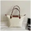Nova Bolsa de Ombro Único Impermeável de Grande Capacidade, Moda Versátil, Tecido Oxford, Bolsa de Viagem/Bolsa de Mão de Nylon para Mães e Senhoras, Modelo Bolinho