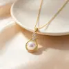 Novo conjunto de brincos e colar estilo francês para outono/inverno em forma de harpa com zircônia cúbica e pérola natural, um conjunto luxuoso e elegante com detalhes em diamante