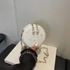 Outono 2026 Nova Mini Bolsa Elegante de Alto Valor com Corrente de Pérolas Bordada Versátil para Ombro Transversal Pequena Redonda