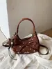 Exquisito bolso de lunares de nicho para mujer, nuevo bolso cruzado versátil de moda 2026, bolso de mano elegante de alta gama