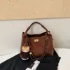 Bolso pequeño de cadena acolchado estilo Chanel con patrón de rombos, un bolso de axila vintage versátil y único, un bolso de mano delicado que se puede llevar en la mano o cruzar sobre el cuerpo