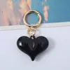 Corea del Sur Dongdaemun Moda Acrílico Amor Coche Llavero Moda Amor Colgante Chica Bolso Colgante