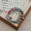 Novos braceletes de cerâmica feitos à mão com contas de Jingdezhen para mulheres, apresentando um estilo chinês moderno, design versátil e uma estética de alta qualidade; atacado disponível