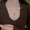 Colgante de Piedra Ojo de Tigre Retro Bañado en Oro Real de 18 Quilates Cadena para Suéter Cadena para Clavícula Moda Otoño e Invierno Collar de Alta Gama