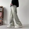 Calça estilo retro americana para homens, adequada para primavera e outono, apresentando um design de moda high-street, um visual lavado e desgastado, e um acabamento em jeans tingido com lama amarela