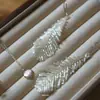 Pendientes de Borla de Pluma de Cisne Hechos a Mano con Cuentas Estilo Hada Tejidos Pendientes Largos Pendientes Ligeros de Lujo para Damas